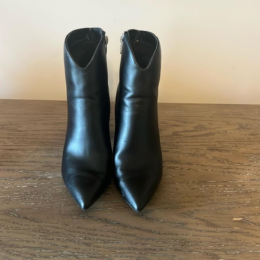 Black, pointed toe, heeled booties.